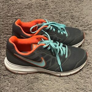 Nike Gray Running Sneakers with Teal Laces and Orange Accents